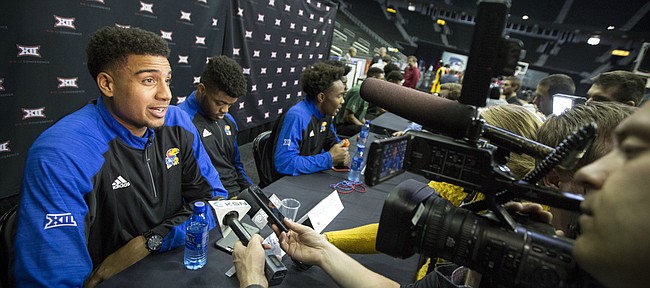 Kansas forward Landen Lucas talks with media members as the Jayhawks and other Big 12 schools sit at tables for interviews during Big 12 Media Day on Tuesday, Oct. 25, 2016 at Sprint Center.