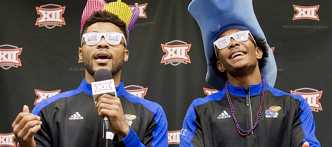 Kansas guards Frank Mason III and Devonte Graham lip sync the words to "Let It Burn" by Usher, during some down time from interviews in the "Social Media" room as part of Big 12 Media Day on Tuesday, Oct. 25, 2016 at Sprint Center.