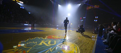 Kansas guard LaGerald Vick runs out to the court as the team is introduced during Late Night in the Phog on Saturday, Oct. 1, 2016 at Allen Fieldhouse.