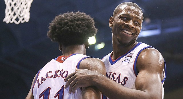 Kansas forward Dwight Coleby (22) gives some love to teammate Kansas guard Josh Jackson (11) after a near explosive dunk by Jackson during the second half, Tuesday, Nov. 1, 2016 at Allen Fieldhouse.