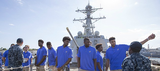 The Kansas Jayhawks talk with navy personnel during a tour of the USS Chafee, a guided missile destroyer at Pearl Harbor on Wednesday, Nov. 9, 2016 in Honolulu, Hawaii.