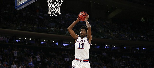 Kansas guard Josh Jackson (11) soars in to the bucket for a jam during the second half of the Champions Classic on Tuesday, Nov. 15, 2016 at Madison Square Garden in New York.
