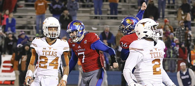Kansas place kicker Matthew Wyman (7) and holder Cole Moos (36) go wild after Wyman's game-winning field goal in overtime against Texas on Saturday, Nov. 19, 2016 at Memorial Stadium.