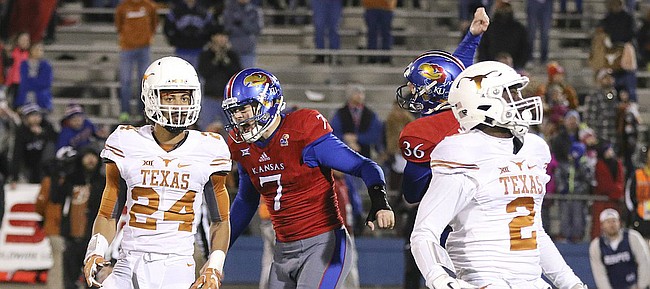 Kansas place kicker Matthew Wyman (7) and holder Cole Moos (36) go wild after Wyman's game-winning field goal in overtime against Texas on Saturday, Nov. 19, 2016 at Memorial Stadium.