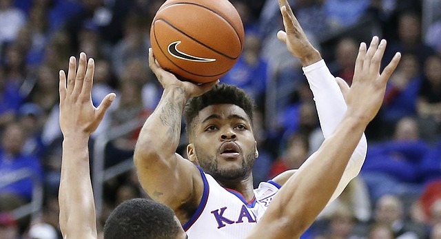 Kansas guard Frank Mason III (0) pulls up for a shot over Georgia guard Juwan Parker (3) during the first half, Tuesday, Nov. 22, 2016 during the championship game of the CBE Classic at Sprint Center.