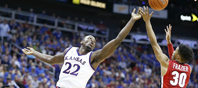 Kansas forward Dwight Coleby (22) tips away a possession from Georgia guard J.J. Frazier (30) during the second half, Tuesday, Nov. 22, 2016 during the championship game of the CBE Classic at Sprint Center.