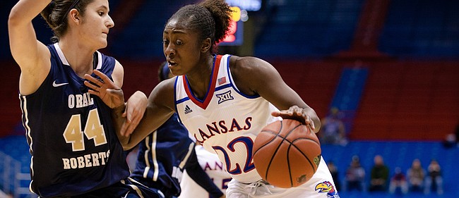 Chayla Cheadle (22) drives to the basket in the first quarter during Wednesday’s game against Oral Roberts. KU won the double-OT competition, 64-56