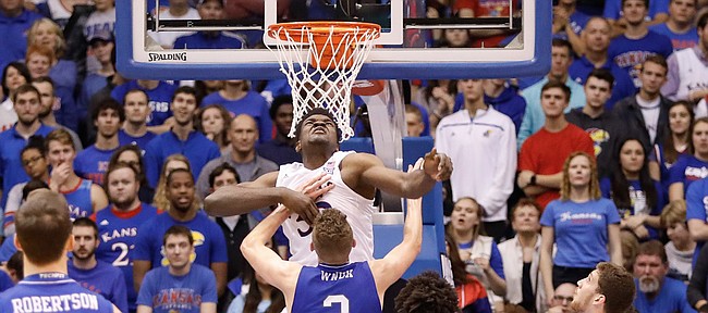 Kansas center Udoka Azubuike (35) rejects on of his 3 blocked shots against UNC Asheville forward Alec Wnuk (2) in the Jayhawks 95-57 win against UNC Asheville Friday night, Nov. 25, in Allen Fieldhouse. 