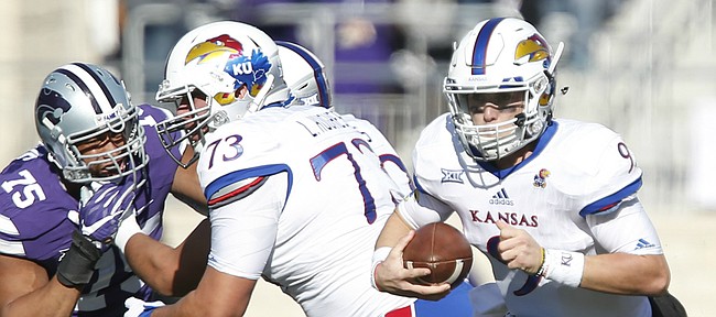 Kansas quarterback Carter Stanley (9) takes off on a run during the first quarter, Saturday, Nov. 26, 2016 at Bill Snyder Family Stadium.