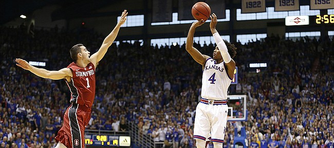 Kansas guard Devonte' Graham (4) pulls up for a three over Stanford guard Christian Sanders (1) during the first half on Saturday, Dec. 3, 2016 at Allen Fieldhouse.