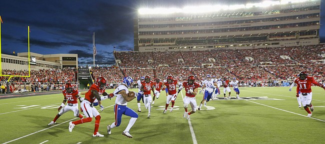 Kansas return man LaQuvionte Gonzalez (1) has nowhere to run as he is forced out of bounds on a kickoff by the Texas Tech defense during the first quarter on Thursday, Sept. 29, 2016 at Jones AT&T Stadium in Lubbock, Texas.