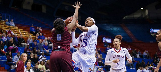 Kansas guard Aisia Robertson (15) goes up for a layup over Harvard's Nani Redford on Wednesday, Dec. 7, 2016 at Allen Fieldhouse. 