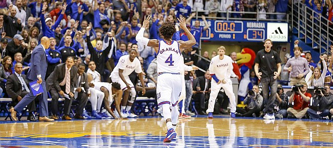 Kansas guard Devonte' Graham (4) turns to the bench after a deep three to end the half against Nebraska on Saturday, Dec. 10, 2016 at Allen Fieldhouse.