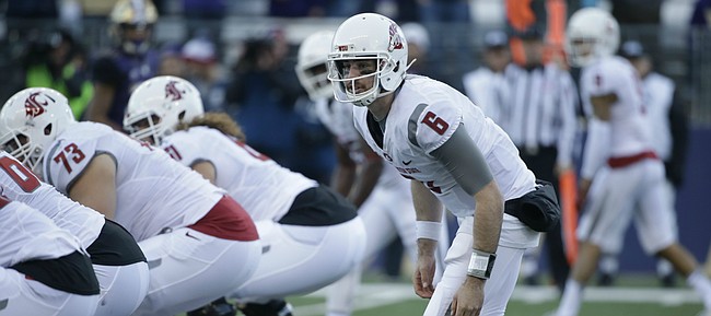 Washington State quarterback Peyton Bender in action in an NCAA college football game against Washington Friday, Nov. 27, 2015, in Seattle. Bender, who played his sophomore season at Itawamba Community College, signed Wednesday, Dec. 14, 2016, with Kansas football.  (AP Photo/Elaine Thompson)

