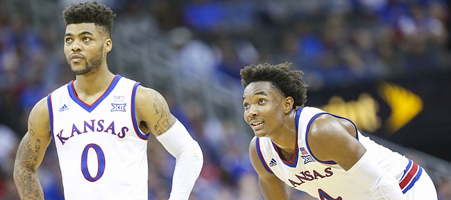 Kansas guard Frank Mason III (0) and Kansas guard Devonte' Graham (4) watch a free throw during the second half, Tuesday, Nov. 22, 2016 during the championship game of the CBE Classic at Sprint Center.