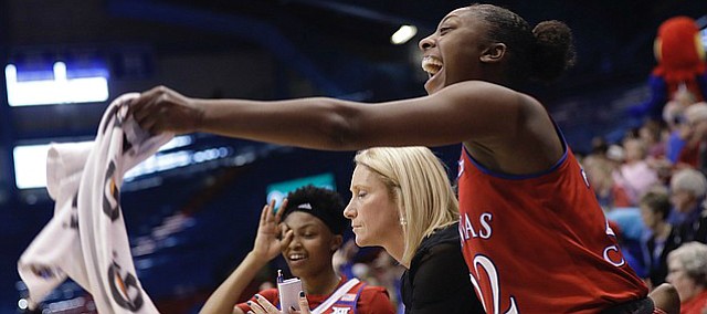 Kansas guard Chayla Cheadle (22), right, cheers from the KU bench after a late three-point basket by teammate Kylee Kopatich in the Jayhawks win over Texas Tech Saturday, Jan. 28, 2017, in Lawrence, Kan. 