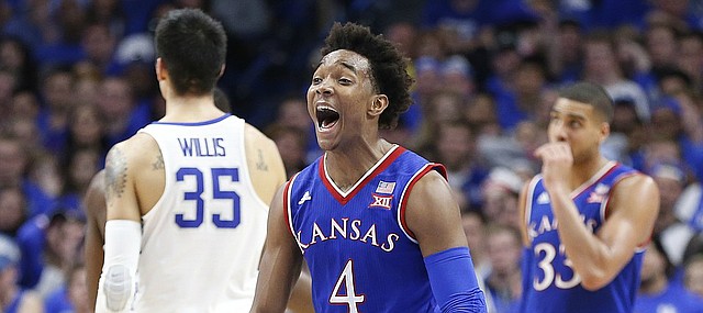 Kansas guard Devonte' Graham (4) turns to the bench with excitement as the Jayhawks pulls away during the second half against Kentucky, Saturday, Jan. 28, 2017 at Rupp Arena in Lexington, Kentucky.