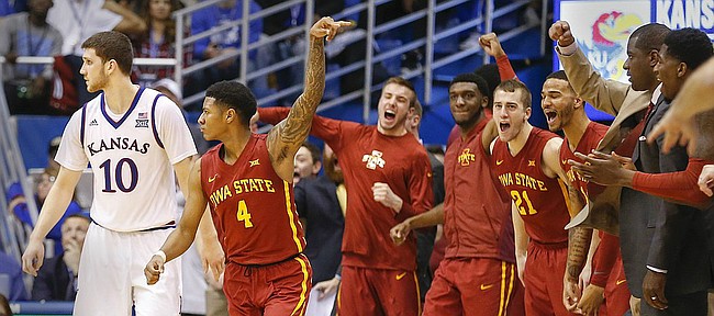 The Iowa State bench reacts after a big bucket by guard Donovan Jackson (4) over Kansas guard Sviatoslav Mykhailiuk (10) late in overtime, Saturday, Feb. 4, 2017 at Allen Fieldhouse.