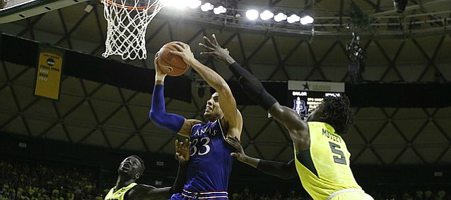 Kansas forward Landen Lucas (33) grabs a rebound and is fouled with seconds remaining during the second half, Saturday, Feb. 18, 2017 at Ferrell Center in Waco, Texas. Lucas hit both free throws to give the Jayhawks the lead.