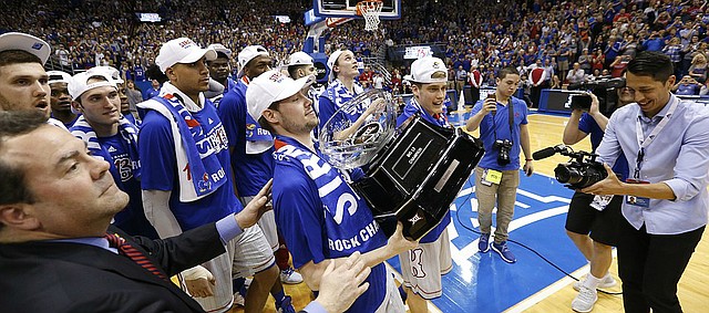 Kansas guard Tyler Self is handed the Big 12 Conference trophy following the Jayhawks' 87-68 win over TCU, Wednesday, Feb. 22, 2017 at Allen Fieldhouse.