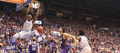 Kansas forward Carlton Bragg Jr. (15) delivers a dunk during the first half, Wednesday, Feb. 22, 2017 at Allen Fieldhouse.