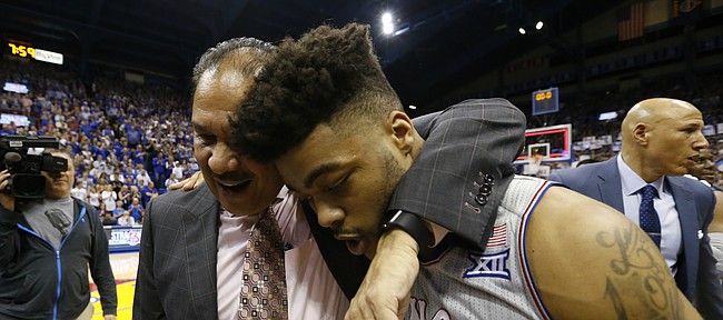 Kansas guard Frank Mason III (0) gets a hug from assistant coach Kurtis Townsend following the Jayhawks' win over TCU for their 13th-straight Big 12 conference title, Wednesday, Feb. 22, 2017 at Allen Fieldhouse.