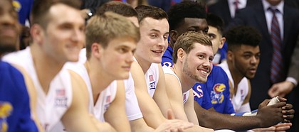 Kansas guard Tyler Self (20) smiles as he listens to his dad talk about him during the Senior Night speeches following the JayhawksÕ 73-63, comeback win over Oklahoma.