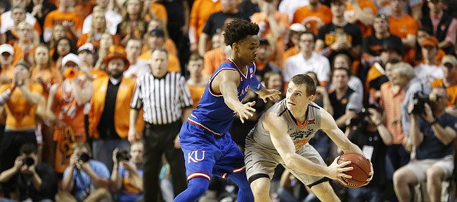 Kansas guard Devonte' Graham (4) pressures Oklahoma State guard Phil Forte III (13) into calling a timeout late in the second half, Saturday, March 4, 2017 at Gallagher-Iba Arena.