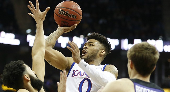 Kansas guard Frank Mason III (0) puts up a floater over TCU guard Alex Robinson (25) during the first half, Thursday, March 9, 2017 at Sprint Center. At right is TCU forward Vladimir Brodziansky (10).