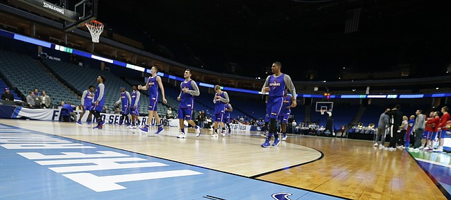 The Jayhawks warm up during a practice on Thursday, March 16, 2017 at BOK Center in Tulsa, Oklahoma.