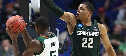 Michigan State guard Miles Bridges (22) defends against a shot from Miami guard Davon Reed (5) during the second half on Friday, March 17, 2017 at BOK Center in Tulsa, Oklahoma.