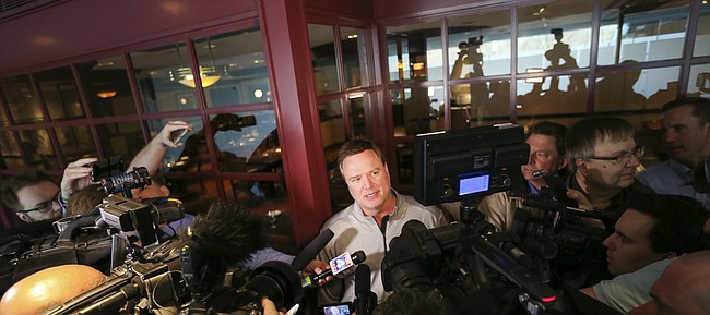 Kansas head coach Bill Self talks with media members shortly after the Jayhawks' arrival at the Westin Crown Center in Kansas City, Mo., on Tuesday, March 21, 2017.