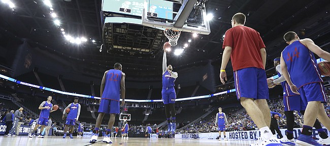 Kansas forward Landen Lucas (33) turns for a shot during a day of practices and press conferences prior to Thursday's game at Sprint Center in Kansas City, Mo.