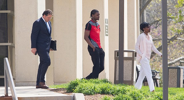 University of Kansas basketball player Josh Jackson leaves the Douglas County Courthouse with his counsel and his mother, Apples Jones, following his arraignment in a criminal damage case on Wednesday, April 12, 2017.