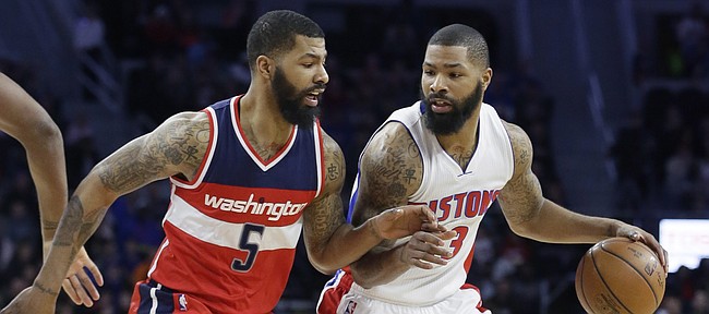 Washington Wizards forward Markieff Morris (5) defends Detroit Pistons forward Marcus Morris during the first half of an NBA basketball game, Friday, April 8, 2016, in Auburn Hills, Mich. (AP Photo/Carlos Osorio)