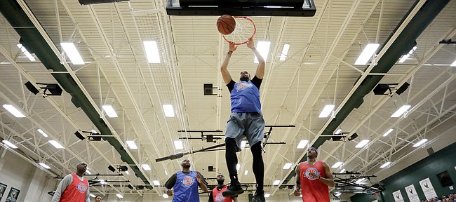 Perry Ellis drives the lane for a slam dunk during the 2017 Rock Chalk Roundball Classic Thursday evening at Lawrence Free State High School. The annual charity event benefits local families fighting cancer