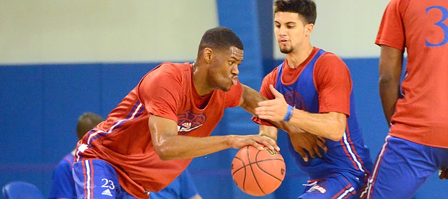 Kansas freshman forward Billy Preston drives toward the paint during a camp scrimmage at Horejsi Family Athletics Center on Wednesday, June 14, 2017, as sophomore Sam Cunliffe defends.