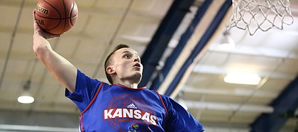 Blue Team forward Mitch Lightfoot  comes in for a dunk before a scrimmage on Wednesday, June 7, 2017 at the Horejsi Family Athletics Center.
