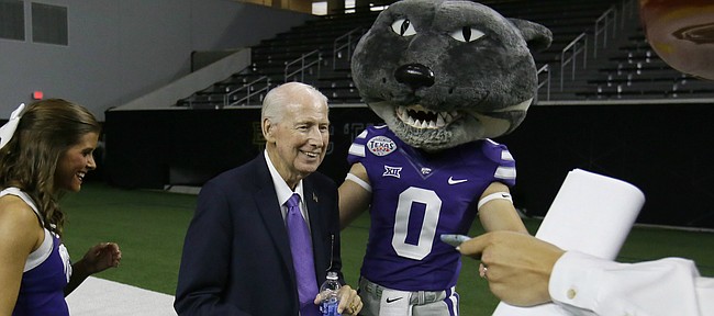 Kansas State head football coach Bill Snyder smiles beside team mascot Willie the Wildcat after speaking to reporters during the Big 12 NCAA college football media day in Frisco, Texas, Tuesday, July 18, 2017. (AP Photo/LM Otero)

