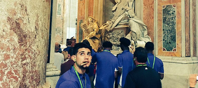 Kansas guard Sam Cunliffe glances back in awe at the ceiling of St. Peter's Basilica during the Jayhawks' tour of Vatican City on Thursday, Aug. 3, 2017. 