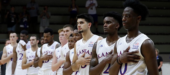 Kansas players listen to their national anthem prior to the start of the basketball match between KU and an Italian selection of players, in Seregno, near Milan, Italy, Saturday, Aug. 5, 2017.