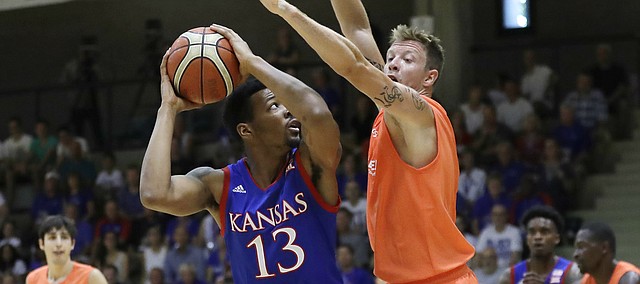 Kansas forward K. J. Lawson, left, looks to score after receiving a pass from Devonte' Graham during a basketball match between KU and Dream Team Italy in Seregno, near Milan, Italy, Sunday, Aug. 6, 2017. Lawson finished with nine points and nine rebounds and Graham tallied 10 assists in the 118-74 Kansas victory. 
