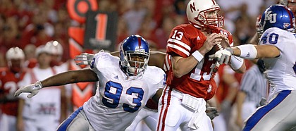 Nick Krug/Journal-World Photo.Kansas defensive lineman James McClinton encloses on Nebraska quarterback Zac Taylor for a sack in the second half.Nick Krug/Journal-World Photo.