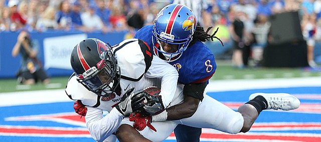 Southeast Missouri wide receiver Trevon Billington (14) pulls in a touchdown catch before Kansas cornerback Shakial Taylor (8) during the second quarter on Saturday, Sept. 2, 2017 at Memorial Stadium.