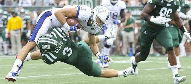 Kansas wide receiver Chase Harrell (3) is taken off of his feet as he is hit by Ohio cornerback Bradd Ellis (3) during the fourth quarter on Saturday, Sept. 16, 2017 at Peden Stadium in Athens, Ohio.