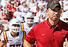Second-year Iowa State head coach Matt Campbell leads his Cyclones onto the field in Norman, Oklahoma, Saturday before they upset No. 3 Oklahoma, 38-31. (Associated Press photo.)