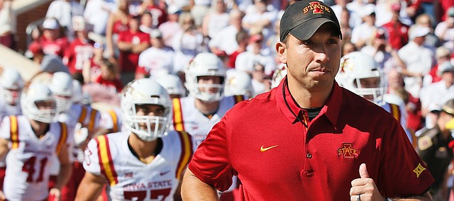 Second-year Iowa State head coach Matt Campbell leads his Cyclones onto the field in Norman, Oklahoma, Saturday before they upset No. 3 Oklahoma, 38-31. (Associated Press photo.)