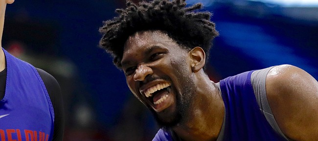 Former Kansas center Joel Embiid laughs while working with Philadelphia teammate Dario Saric in Allen Fieldhouse on Thursday, Oct. 12, 2017, during a Sixers practice.
