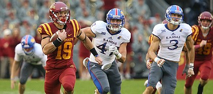 Kansas special teams players Keith Loneker Jr. (47) and Chase Harrell (3) trail behind Iowa State punt returner Trever Ryen (19) as he takes off up the field for a touchdown during the second quarter on Saturday, Oct. 14, 2017 at Jack Trice Stadium in Ames, Iowa.