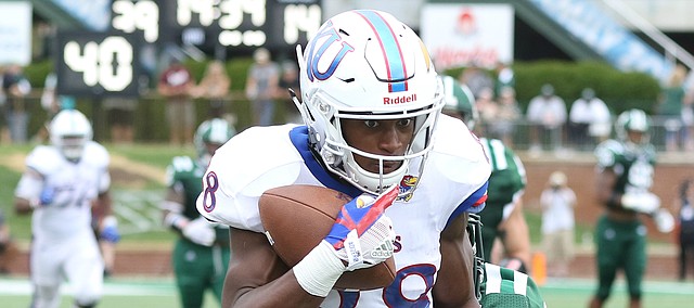 Kansas wide receiver Jeremiah Booker (88) pulls in a deep pass as he is dragged down during the fourth quarter on Saturday, Sept. 16, 2017 at Peden Stadium in Athens, Ohio.